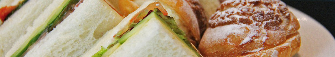 Eating Chicken Wing Mediterranean Sandwich at Torino's Sandwiches restaurant in Pasadena, CA.
